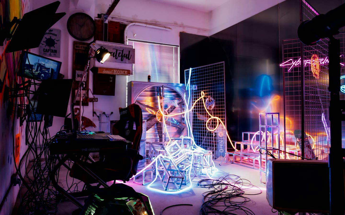 A colorful neon installation inside a creative studio