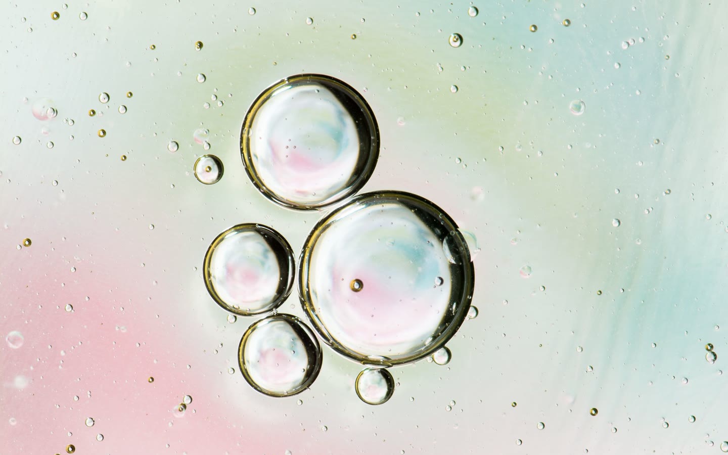 Soft pastel bubbles photographed through glass